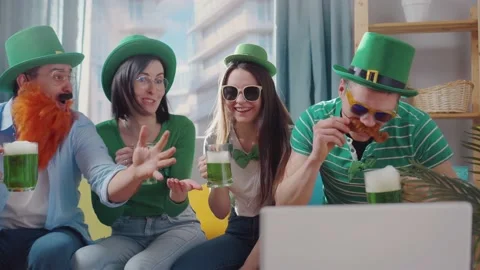 St. Patrick's day a group of friends at home with a laptop Stock Footage 149477627