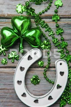 St Patrick's Day lucky horse shoe and green shamrock Stock Photos
