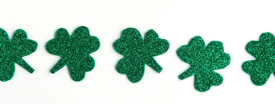 St. Patrick's Day shamrocks pattern on white background. Stock Photos