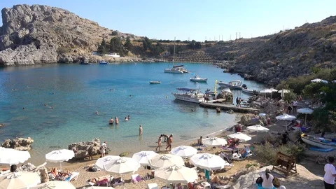 St. Paul's Bay, sandy beach, people swimming, clear Mediterranean sea, Lindos Stock Footage 120833564
