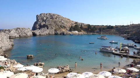 St. Paul's Bay, sandy beach, boats, people swimming, clear Mediterranean sea Stock Footage 120833566