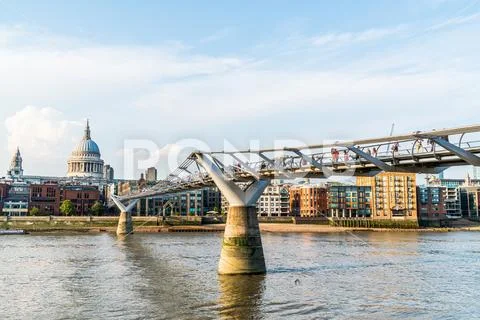 St Pauls Cathedral and the Millennium Bridge at sunset landscape Stock Photos