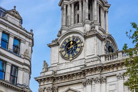 St Pauls Cathedral clock tower in London against clear blue summer sky, baroque Stock Photos