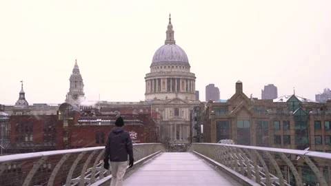 St Paul's Cathedral, London in the snow.  View from Millennium Bridge. Stock Footage