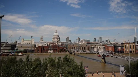 St Paul's Cathedral &amp; Millenium Bridge over the River Thames Stock Footage 90077542