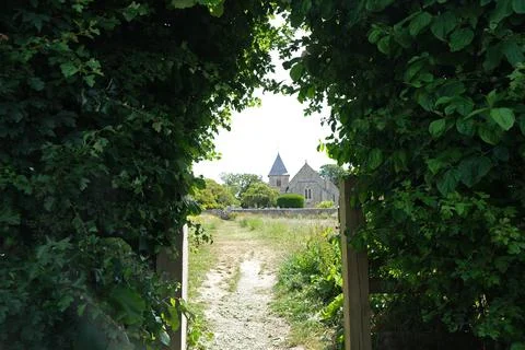 St Peter and St Paul Parish Church Framed by a Natural Archway of Green Folia Stock Photos