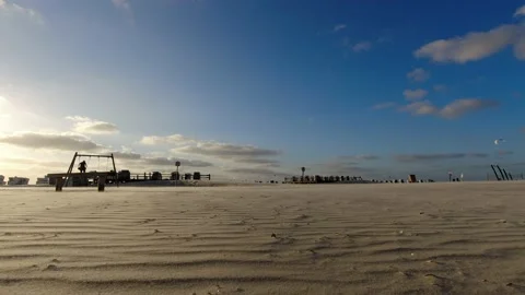 St. Peter-Ording Beach Sankt Peter-Ording Strand Sand Ocean Germany Swingset Stock Footage 205549836