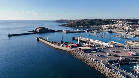 St Peter Port Guernsey backwards drone flight from docks following sea wall of Stockbeeldmateriaal 332812659
