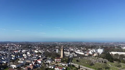 St Peter Port Guernsey high circling drone footage of the Arsenal,fire station Stock Footage 334086695