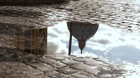 St Peter’s Dome, Vatican reflected in a puddle Stock Footage