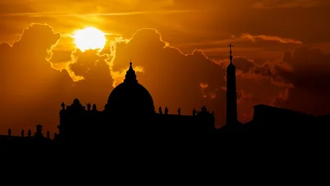 St. Peter's Square and Basilica in Vatican City at sunset with Red Sun, Rome Stock Footage 101677995