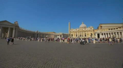 St. Peter's Square in front of St. Peter's Basilica with people sightseeing Stock Footage 66990330