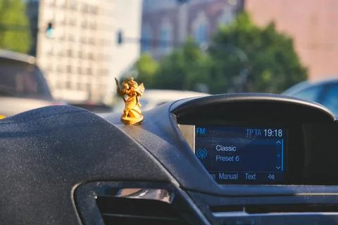 St Raphael Statue on a Car Photos