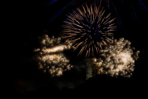 St. Rumbold's Tower surrounded by exploding fireworks. Stock Photos