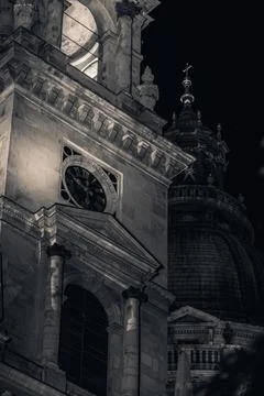St. Stephen's Basilica clock tower and dome, Budapest, low angle night monochrom Stock Photos