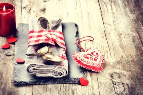St Valentine's table setting in red tone on old wooden table Stock Photos