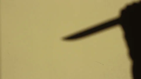 Stabbing Shadow on Wall Stock-Footage 32184828