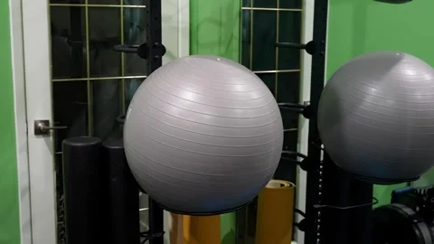Stability exercise ball with foam rollers in physiotherapy gym Stock Footage 330584080