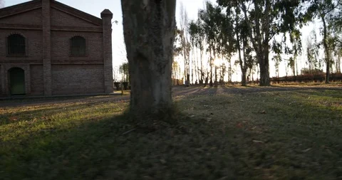 Stabilized camera motion of big brick construction at sunset golden hour Stockbeeldmateriaal 91773701