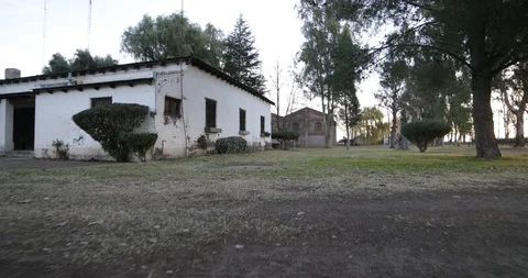 Stabilized camera motion of big brick construction at sunset golden hour 스톡 동영상 92051660
