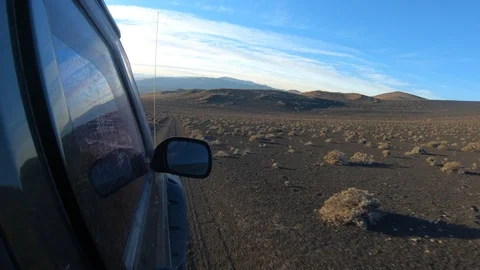Stabilized camera movement over from outside a van at sunset golden hour. 스톡 동영상 91525717