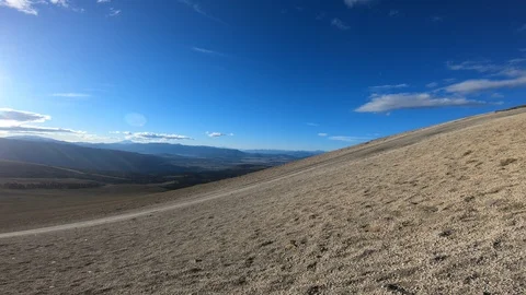 Stabilized camera movement panning left at Batea Mahuida volcano slope 스톡 동영상 91546305