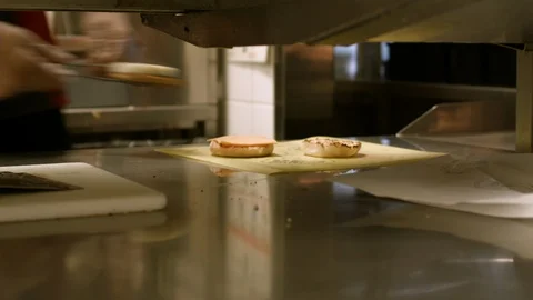 Stabilized shot of breakfast sandwich being prepared in a fast food Stock Footage 115847293