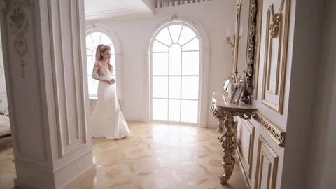 Stabilized shot of bride walking to the boudoir table Stock-Footage 104576000