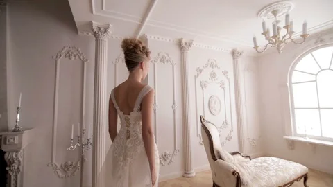 Stabilized shot of elegant bride walking in luxury interior Видео 104576536