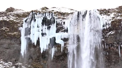 Stabilized Smooth panorama near the winter waterfall Seljalandsfoss Stock Footage 137002049