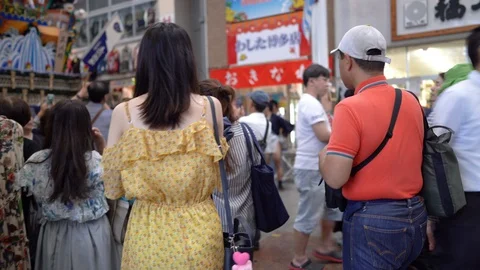 Stabilizer shot of public visitors taking photo of decoration float or Stock Footage 127912153