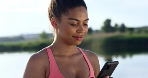 Stable camera view of lovely African American female using her digital device Stock Footage 278224485