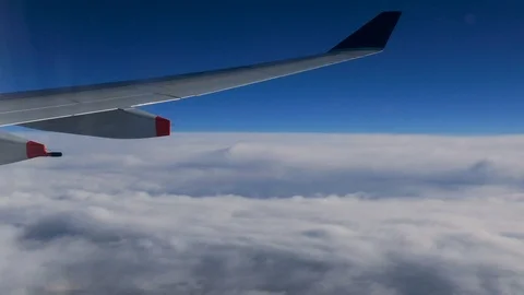 Stable POV passenger view looking at moving clouds from above in sky Stock Footage 97947097