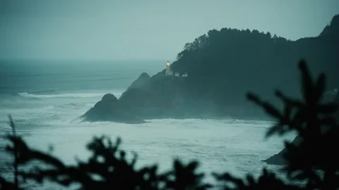 Stable Shot of Lighthouse Cabin on Mountain Overlooking Calm Evening Sea Stock Footage 315099105