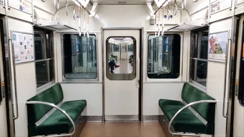 Stable shot taken from the inside of a moving train in Kyoto City. Stock Footage 103213792