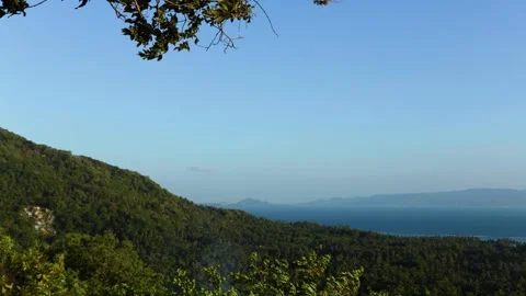 Stable Wide View of Mountain, Sea, and Distant Tropical Island Stock-Footage 339406595