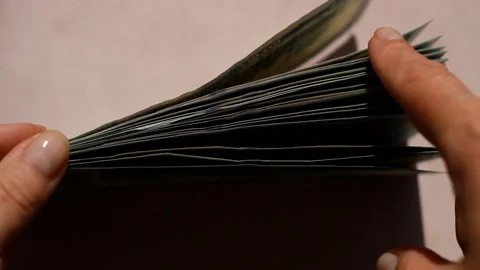 Stack 100 dollar bills and stack of one hundred USA dollar bills. Stock-Footage 201602119