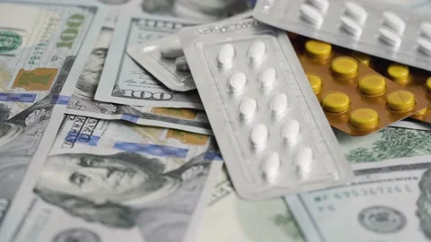 Stack of 100 dollar bills with medicine blister Stock Footage 167019054