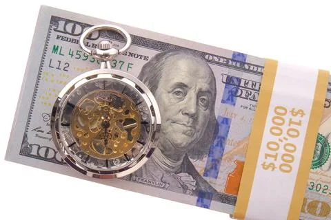 Stack of 10.000 in hundred dollar bills with a modern pocket watch placed on top 写真素材