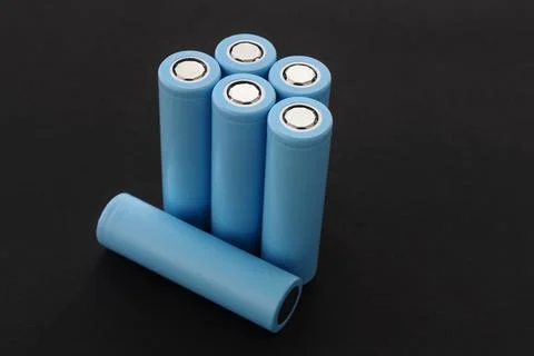 Stack of 18650 cylindrical batteries on black background, Stockfoto's