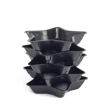 Stack of 5 metal star-shaped baking molds, isolated on white background, shal Stock Photos