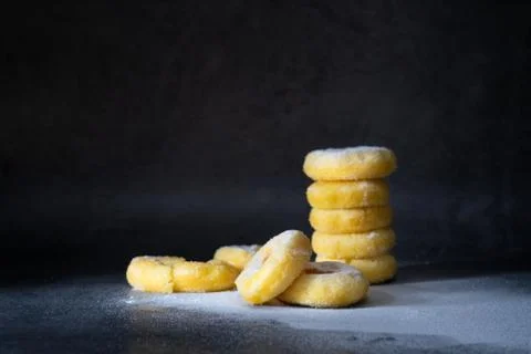Stack of 5 sweet sugar donuts on dark background Stock Photos
