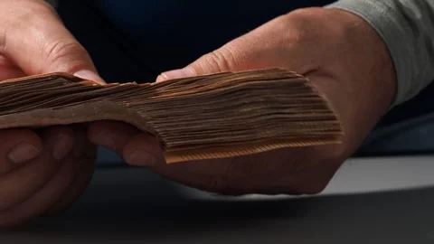 A stack of 50 euro banknotes in hands, the concept of savings banks, banking, pa Stock Footage 247570539