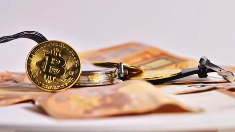 Stack of 50 Euro Bills, Golden Bitcoin Token, and Elegant Watch, Digital Economy Stock Footage 303951353