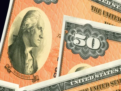 Stack of $50 paper United States savings bonds. Stock Footage
