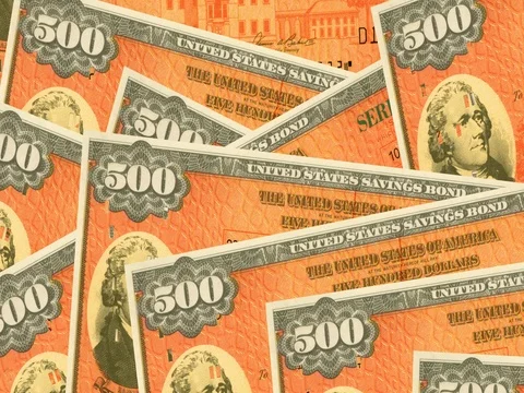 Stack of $500 paper United States savings bonds. Stock Footage 76233564