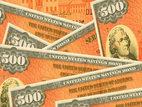 Stack of $500 paper United States savings bonds. Stock Footage 76579611