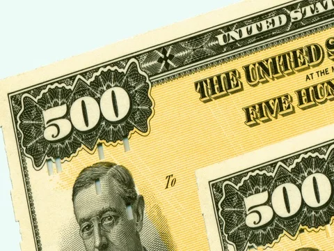 Stack of $500 yellow paper United States savings bonds. Stock Footage 76587011