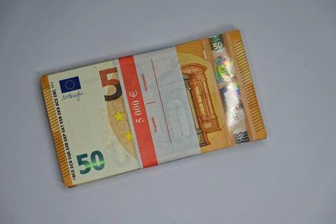 Stack of 5000 in fifty euro banknotes wrapped with value band 스톡 사진
