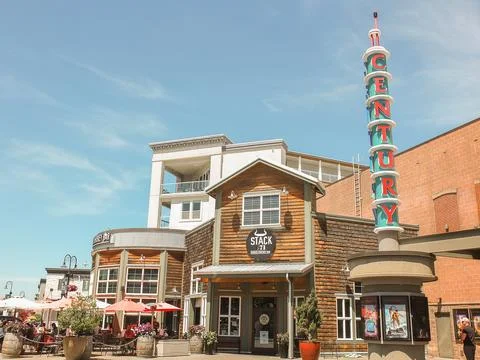 Stack 571 Burger and Whiskey Bar wooden building facade next to a retro cin.. Фото